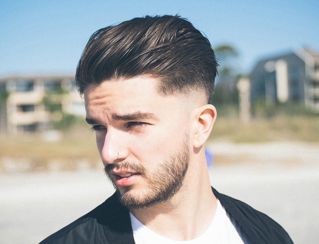 close-up of a man with a pompadour